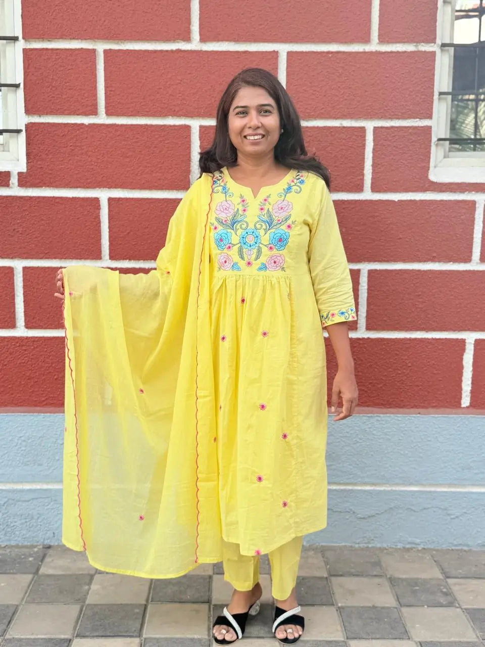 Yellow color A-line kurta set with embriodery