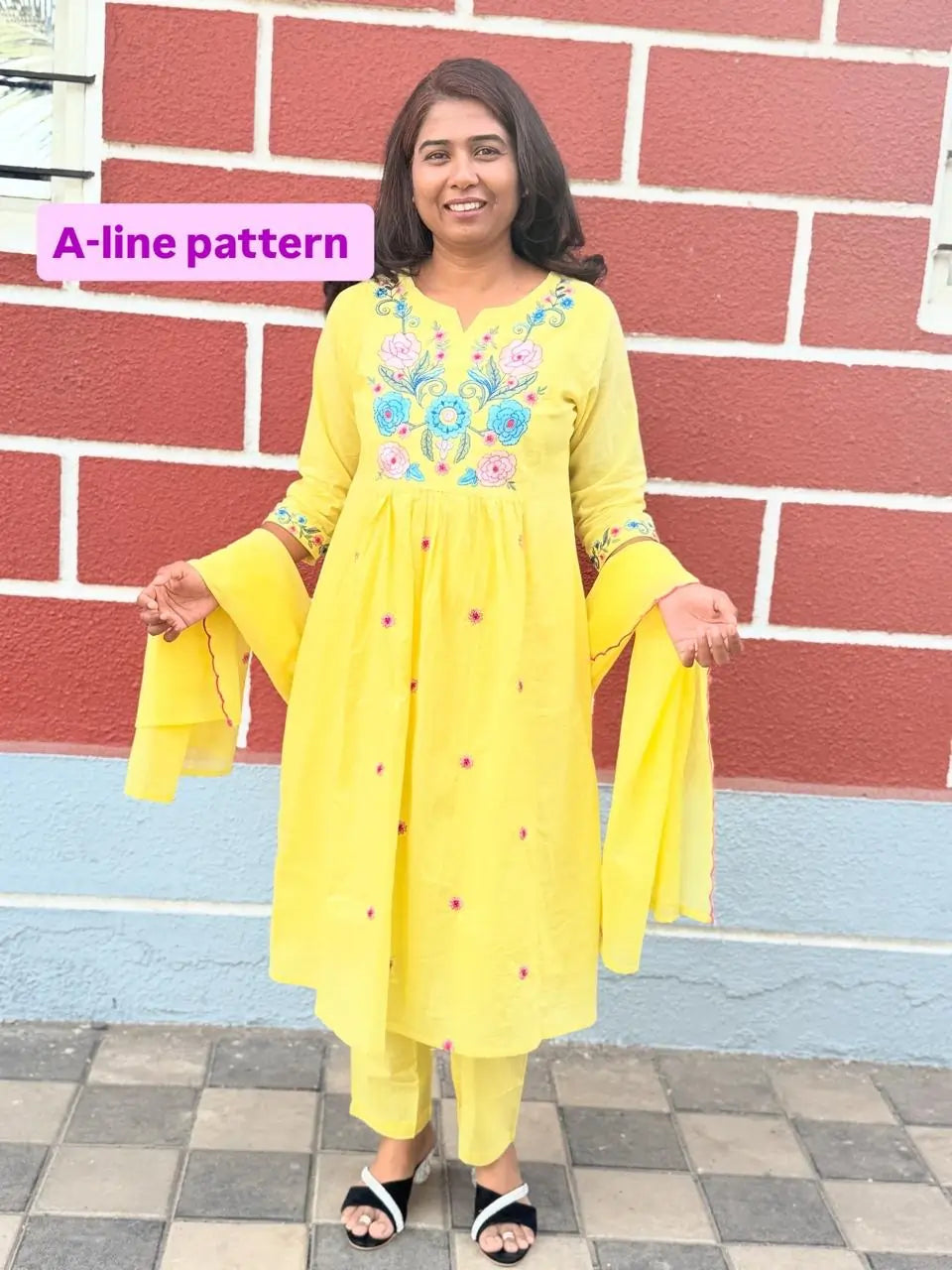 Yellow color A-line kurta set with embriodery