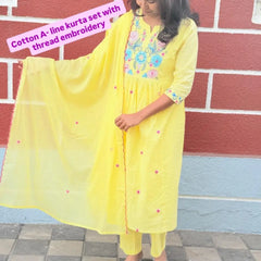 Yellow color A-line kurta set with embriodery