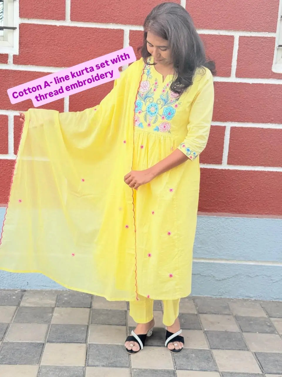 Yellow color A-line kurta set with embriodery