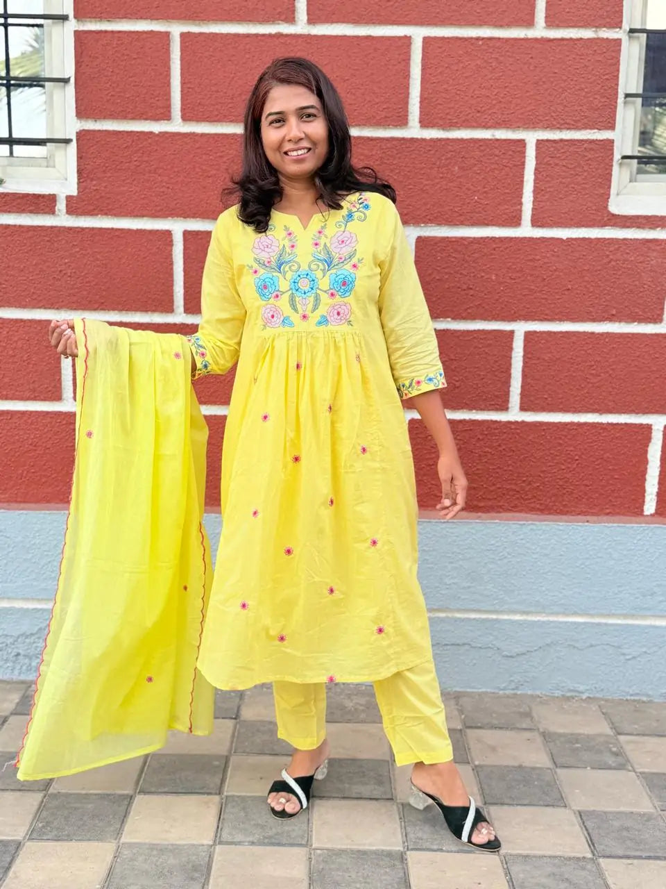 Yellow color A-line kurta set with embriodery