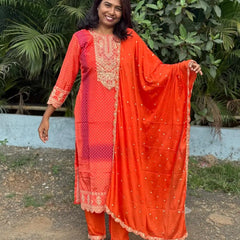 Orange color straight kurta set with embroidery