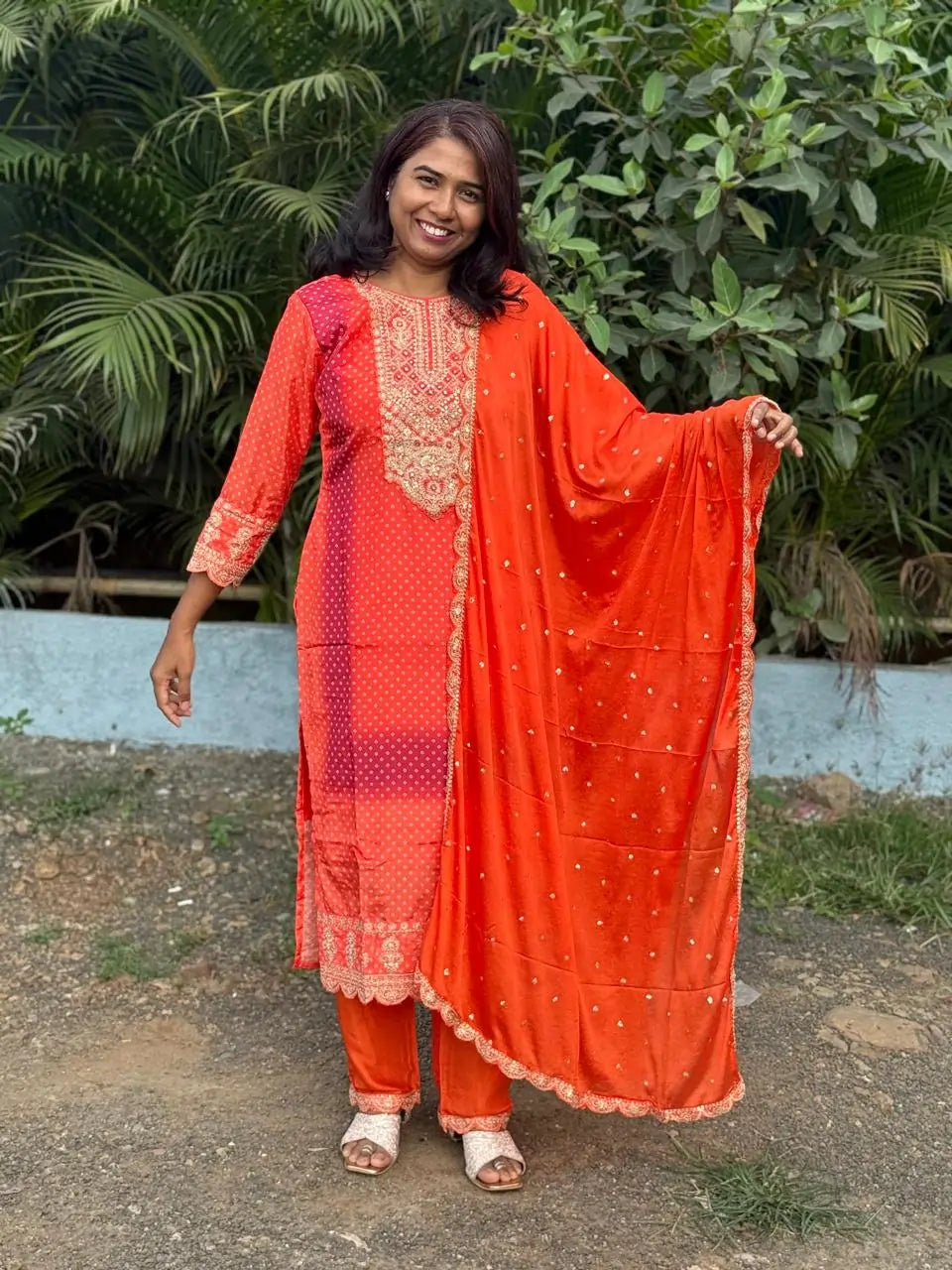 Orange color straight kurta set with embroidery