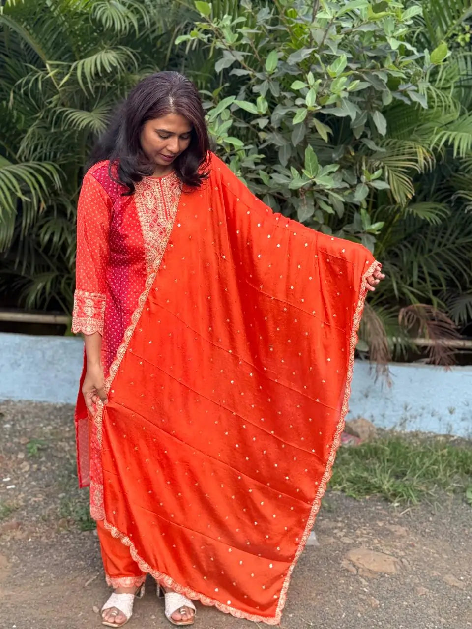 Orange color straight kurta set with embroidery