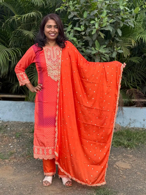 Orange color straight kurta set with embroidery