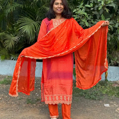 Orange color straight kurta set with embroidery