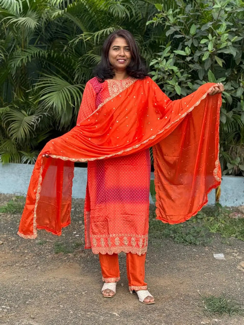 Orange color straight kurta set with embroidery