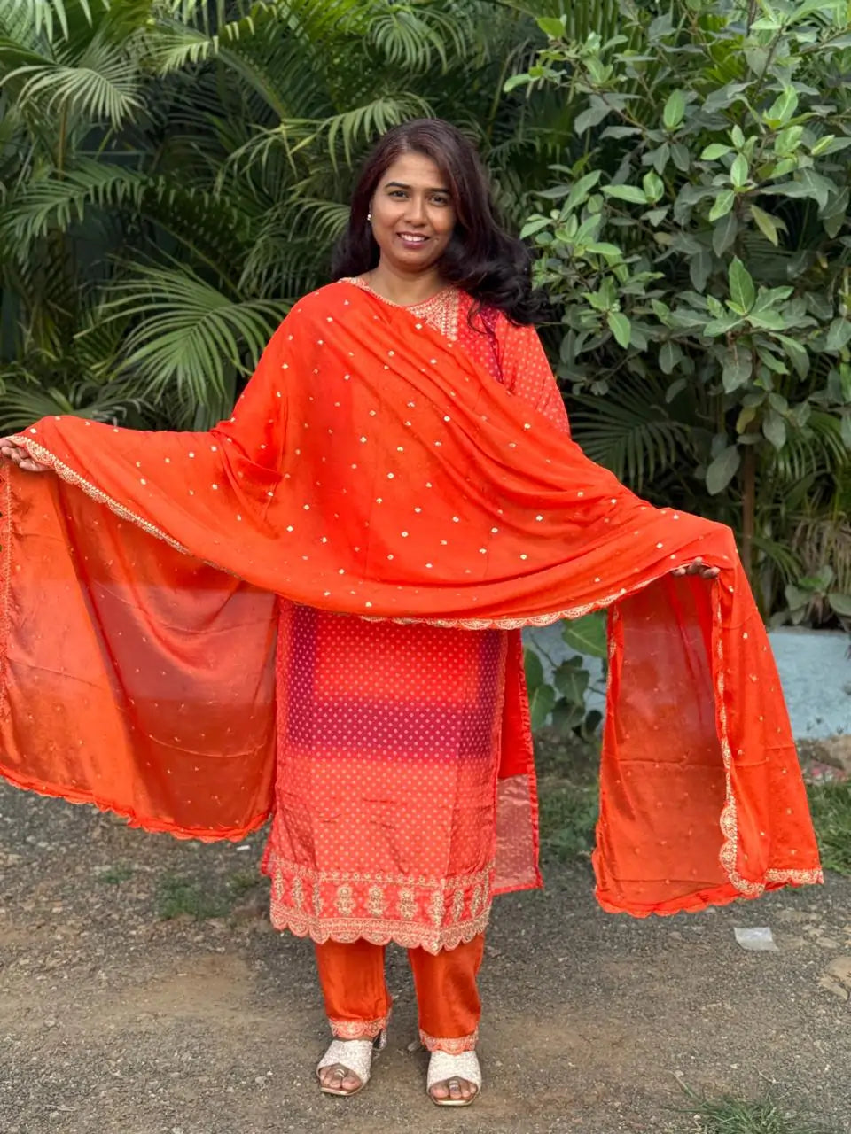 Orange color straight kurta set with embroidery