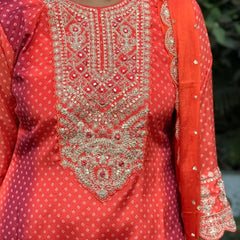 Orange color straight kurta set with embroidery