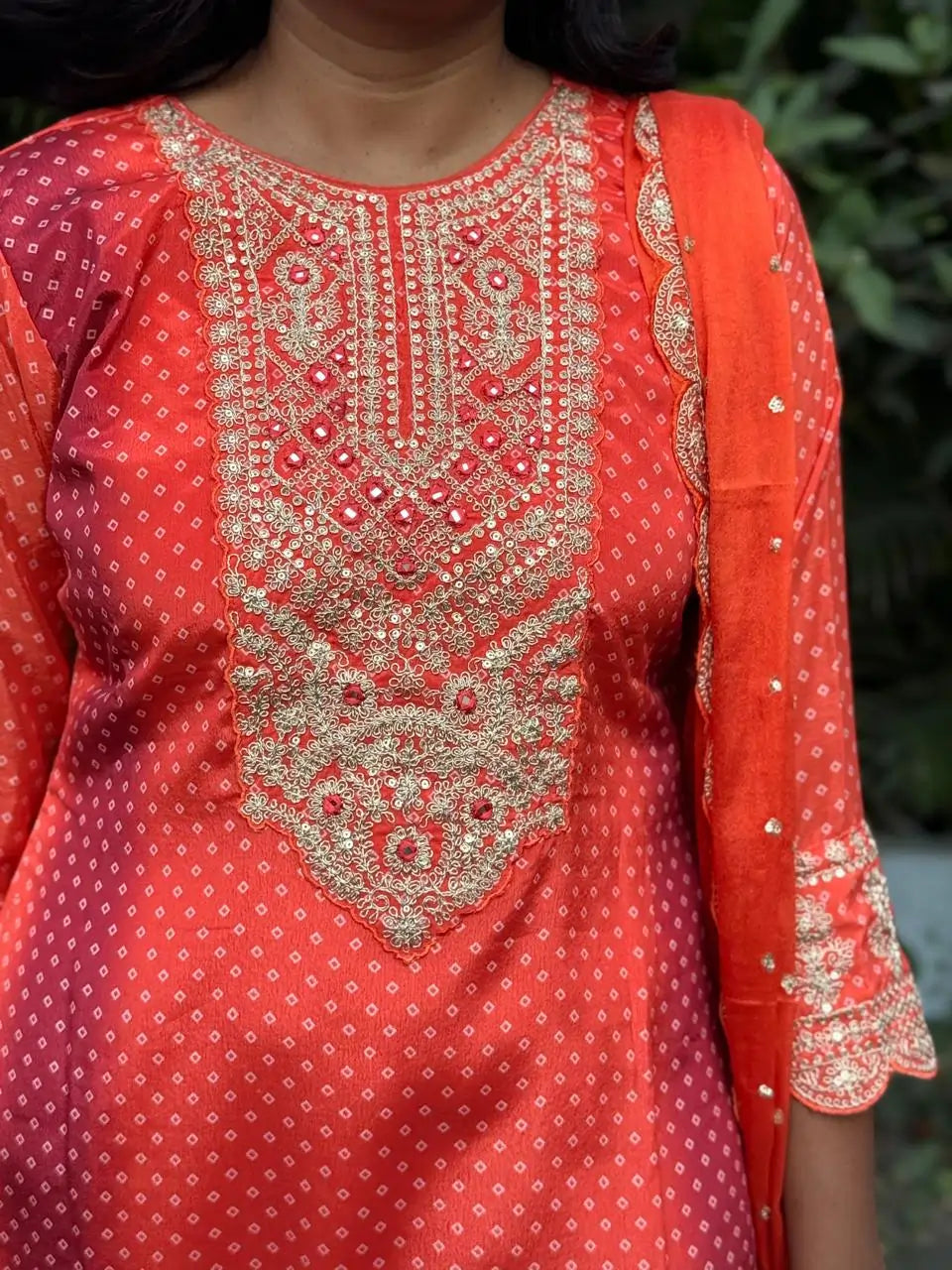 Orange color straight kurta set with embroidery