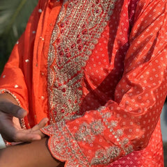 Orange color straight kurta set with embroidery