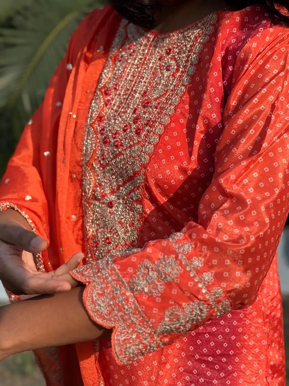 Orange color straight kurta set with embroidery