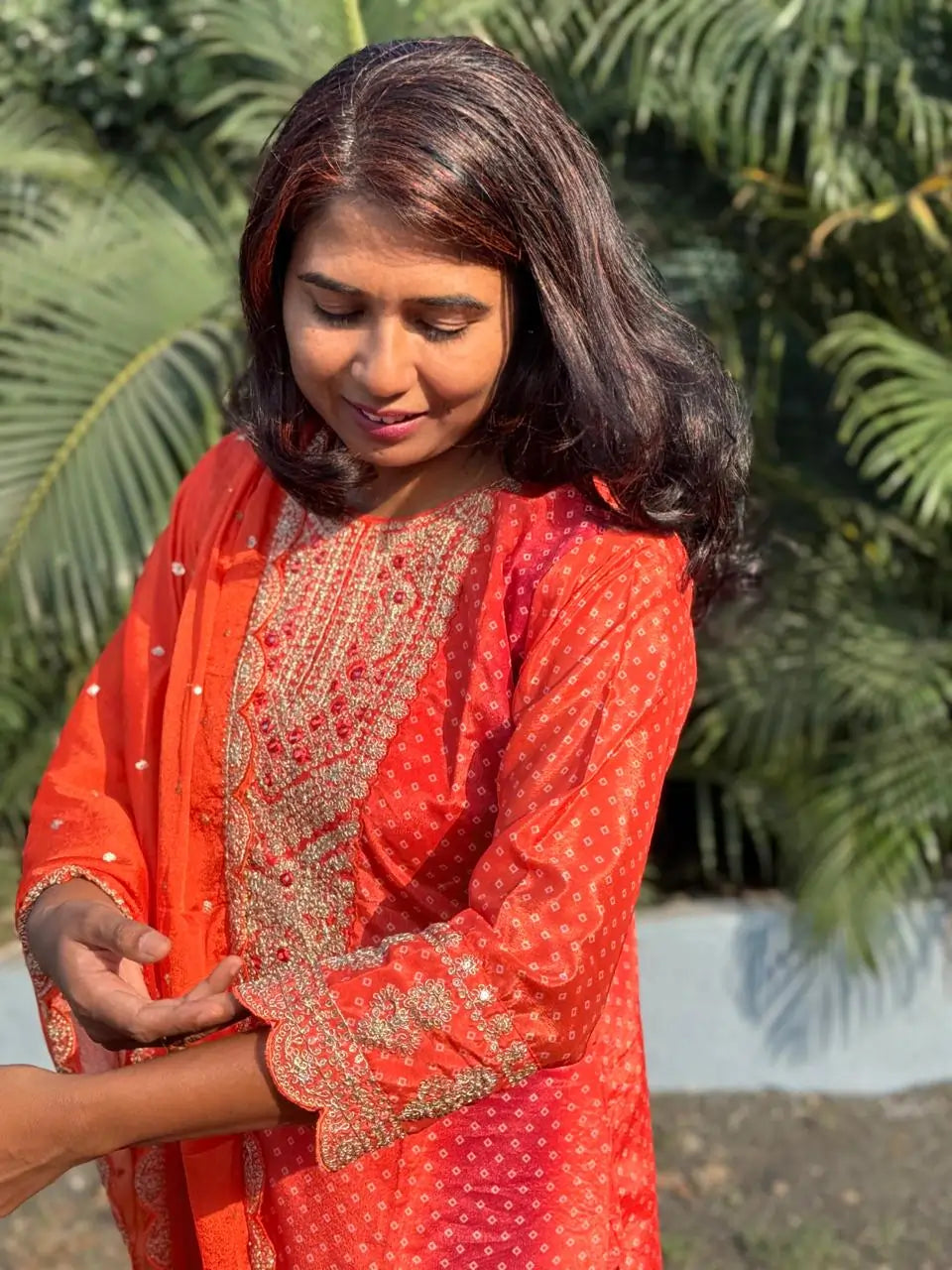 Orange color straight kurta set with embroidery