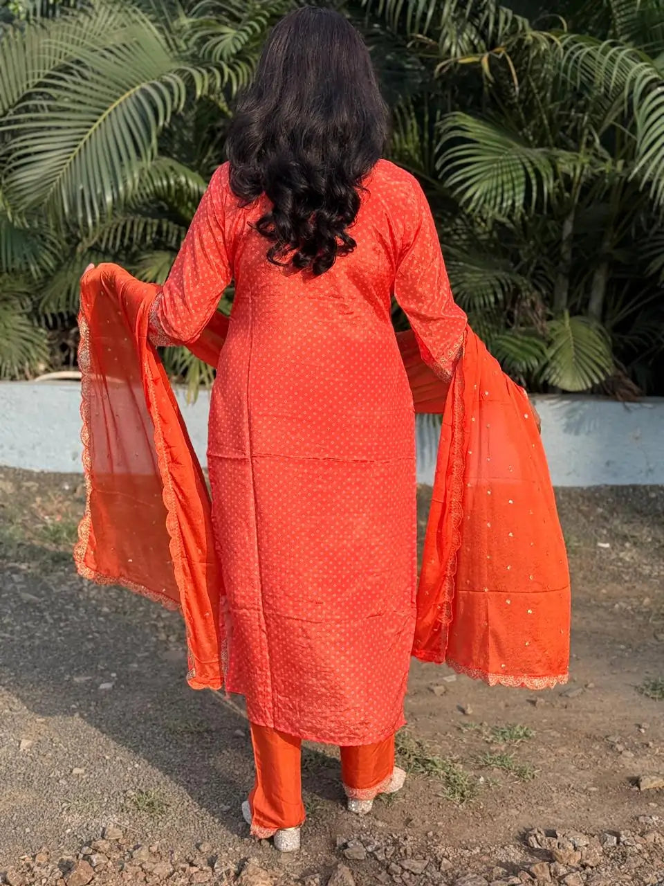 Orange color straight kurta set with embroidery