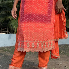 Orange color straight kurta set with embroidery