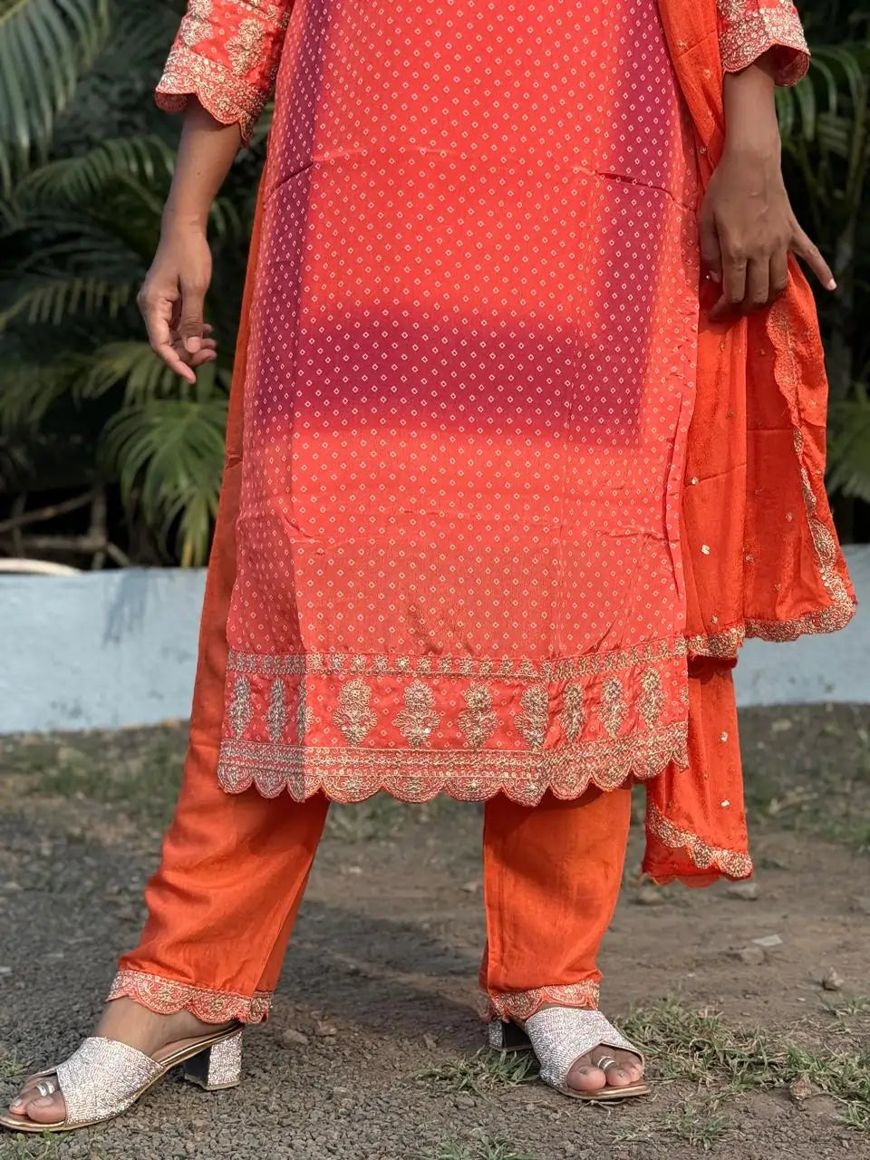 Orange color straight kurta set with embroidery
