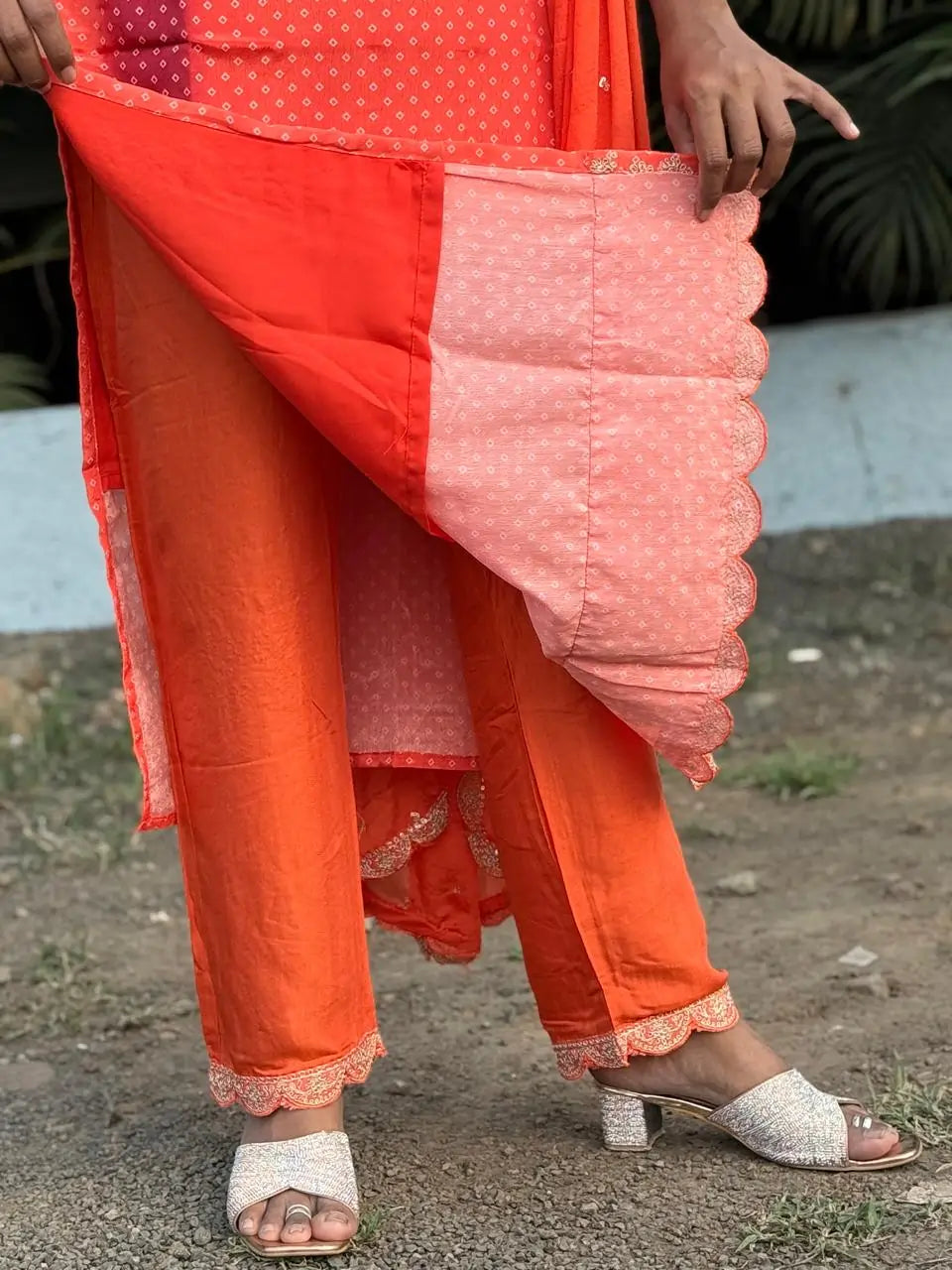 Orange color straight kurta set with embroidery
