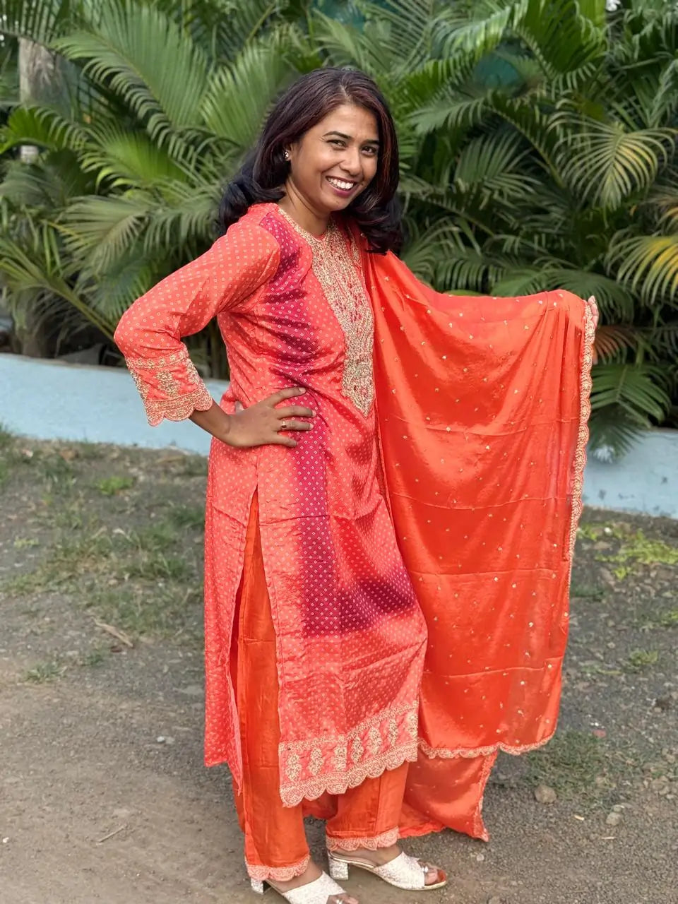 Orange color straight kurta set with embroidery